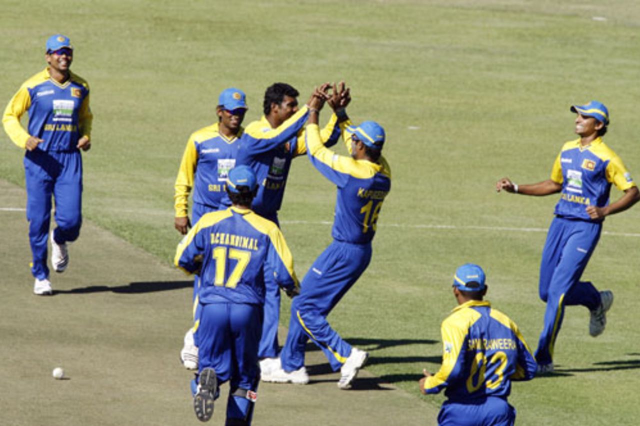 Sri Lanka's fielders celebrate the fall of Dinesh Karthik, Sri Lanka v India, Tri-series, 5th ODI, Harare, June 5, 2010