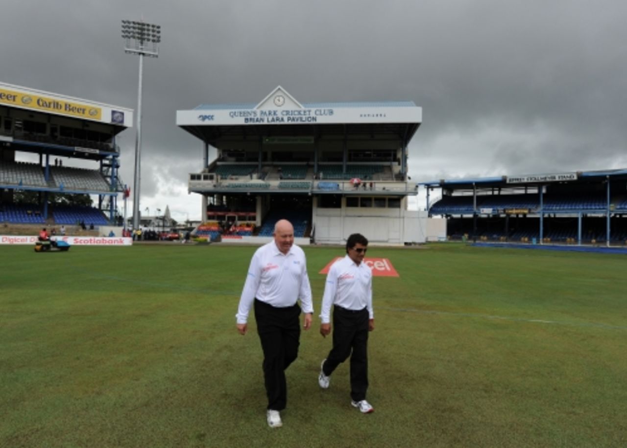 Umpires Steve Davis and Asad Rauf inspect the pitch before the start of play, West Indies v South Africa, 1st Test, Port of Spain, June 10, 2010