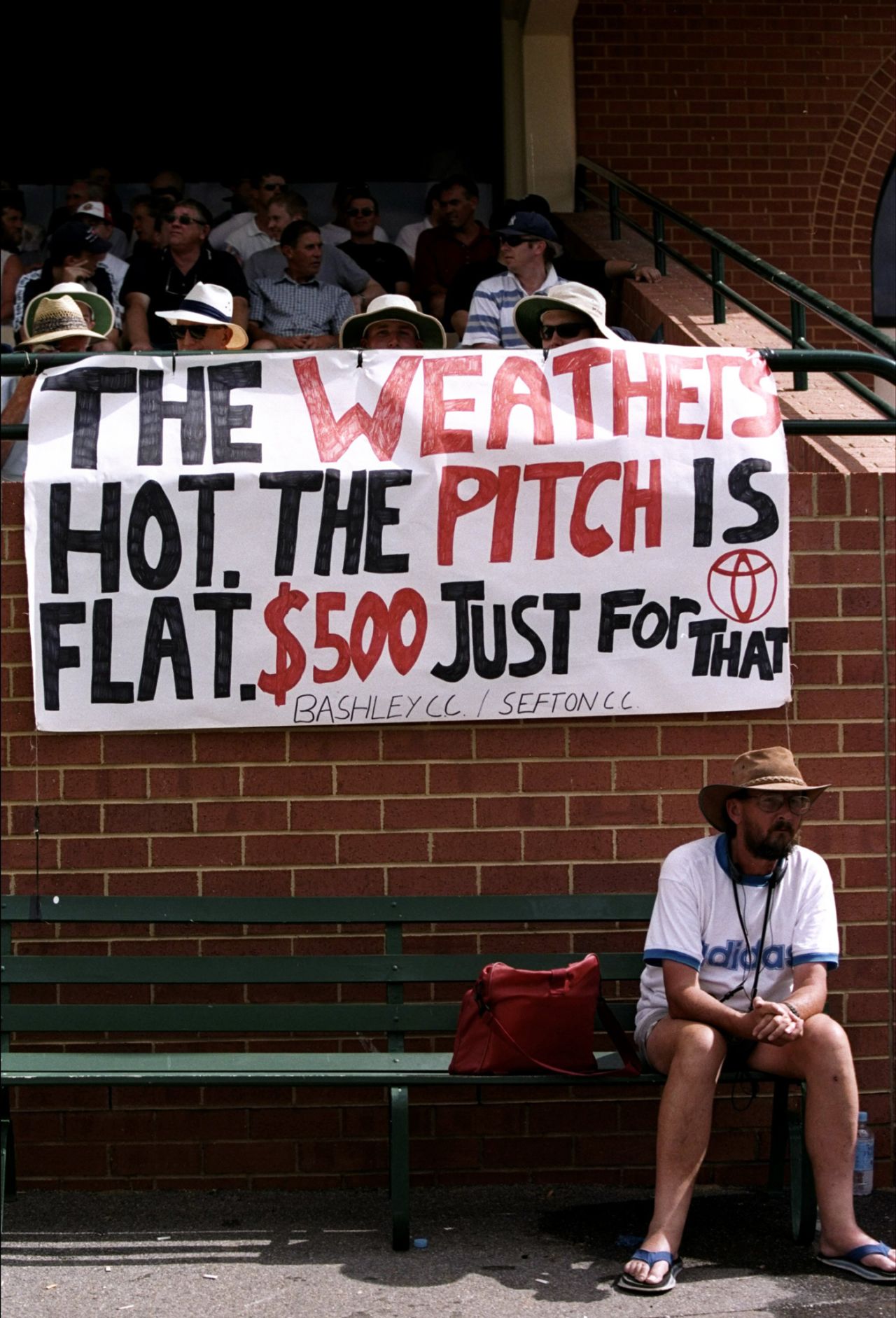 Spectators display a banner referring to the betting scandal involving Mark Waugh and Shane Warne, third Test, Australia v England, Adelaide, 11 December 1998