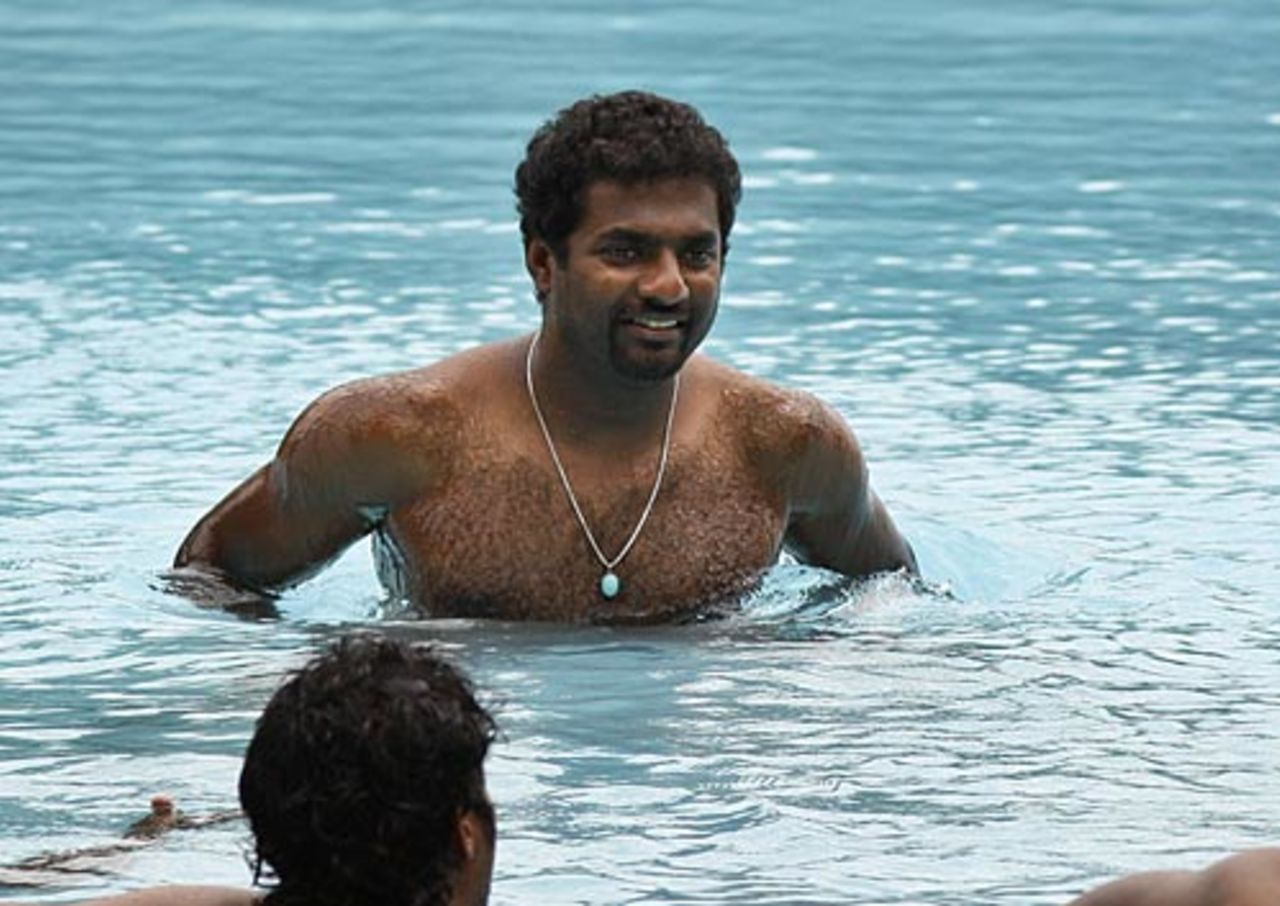 Muttiah Muralitharan cools off in a swimming pool ahead of the Asia Cup final, Dambulla, June 23, 2010