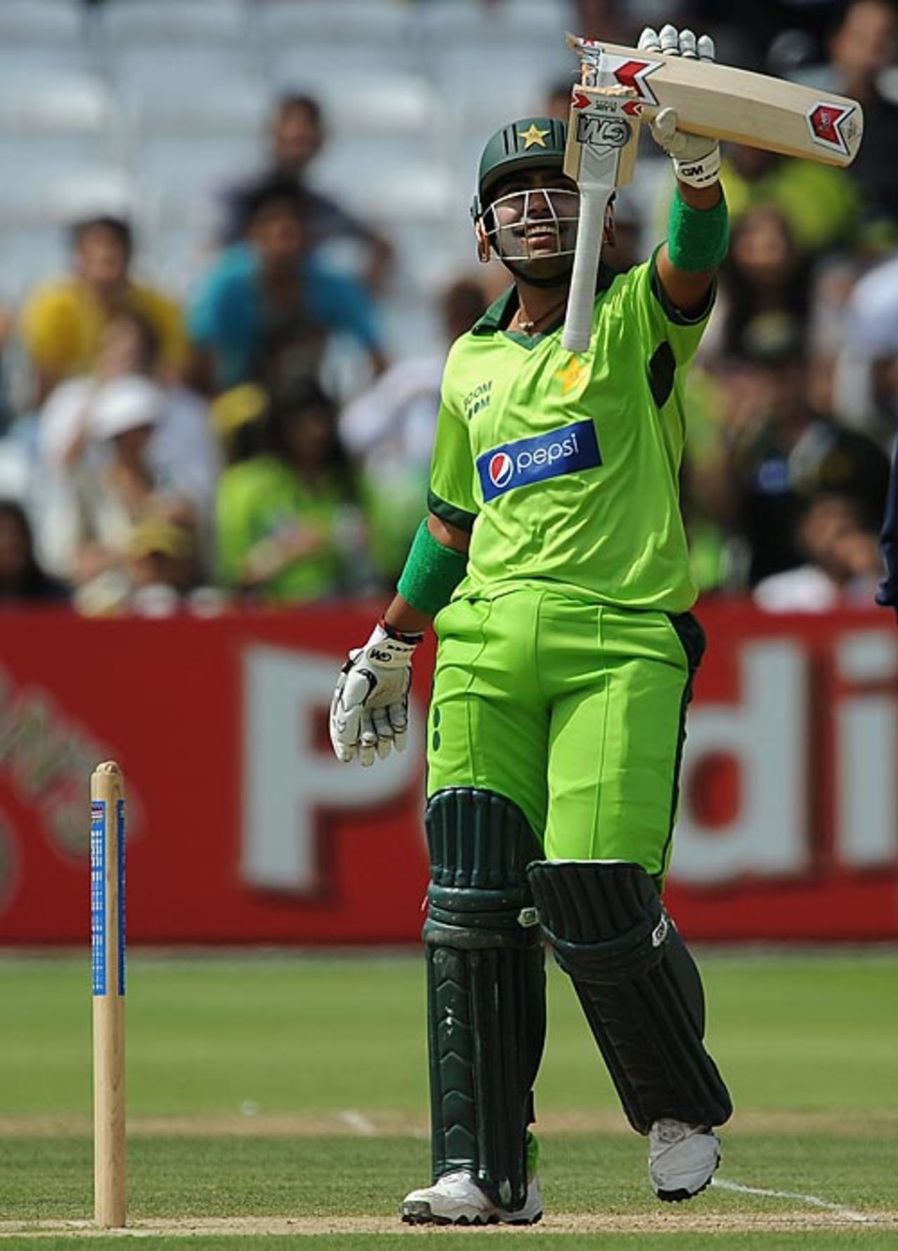 Umar Akmal holds up a broken bat, MCC v Pakistan XI, Twenty20, Lord's, June 27, 2010