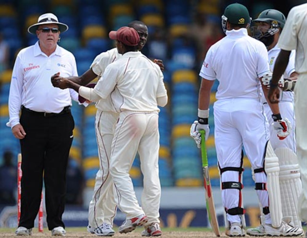 Shivnarine Chanderpaul takes Kemar Roach away from an argument with Jacques Kallis, West Indies v South Africa, 3rd Test, Barbados, 4th day, June 29, 2010 