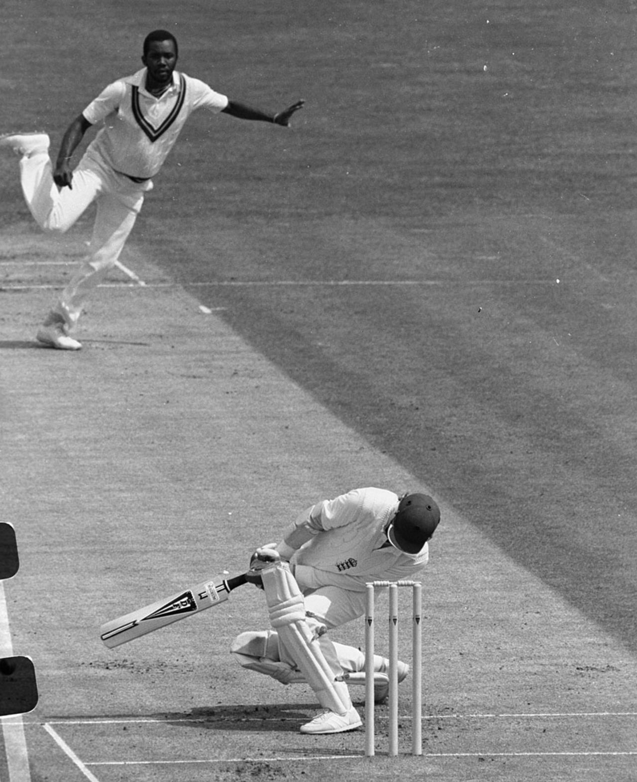 Andy Lloyd tries to unsuccessfully avoid a Malcolm Marshall bouncer, England v West Indies, Edgbaston, 1984