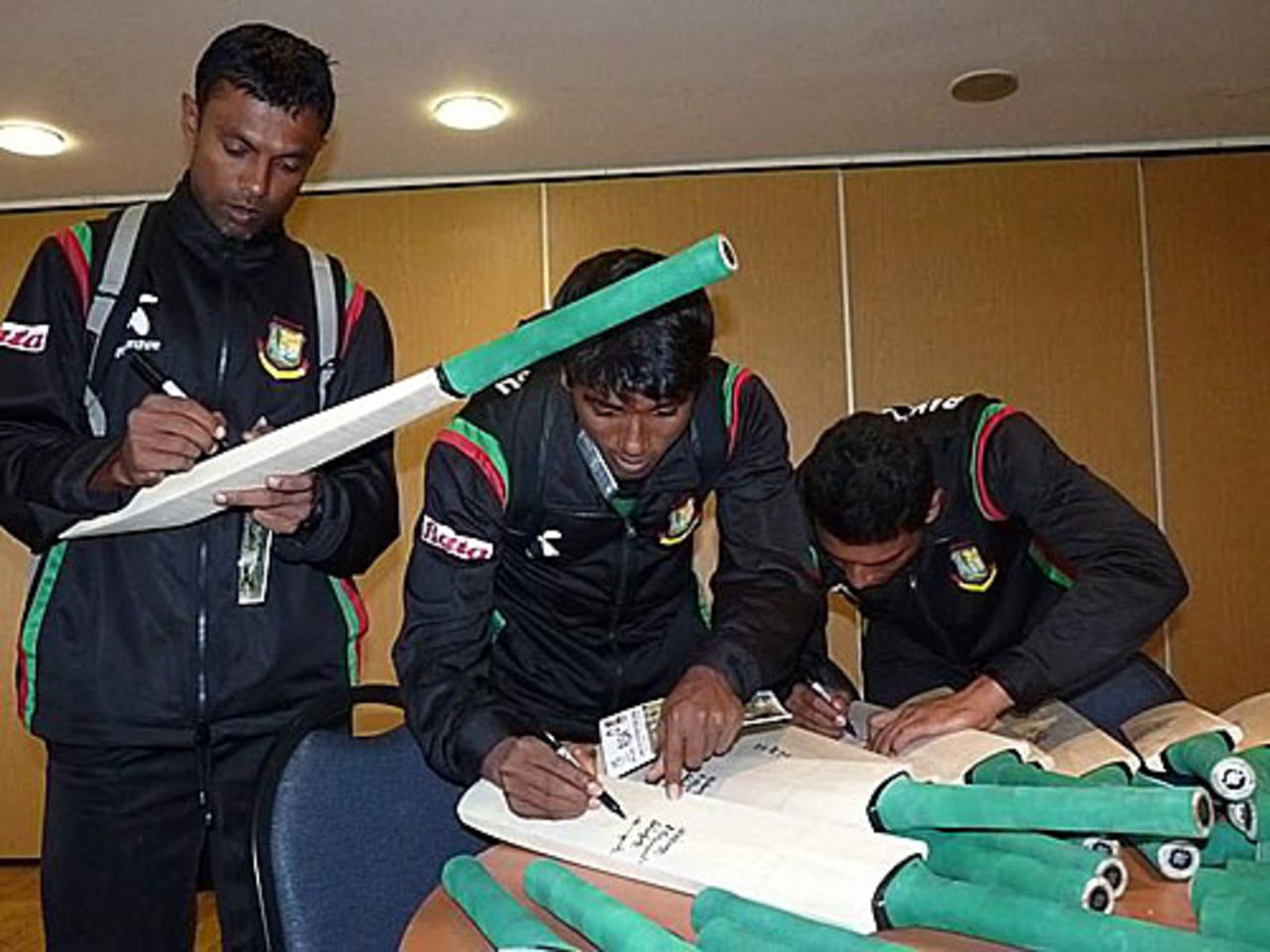 A few Bangladesh players autograph memorabilia bats for Cricket Ireland, Belfast, July 14, 2010