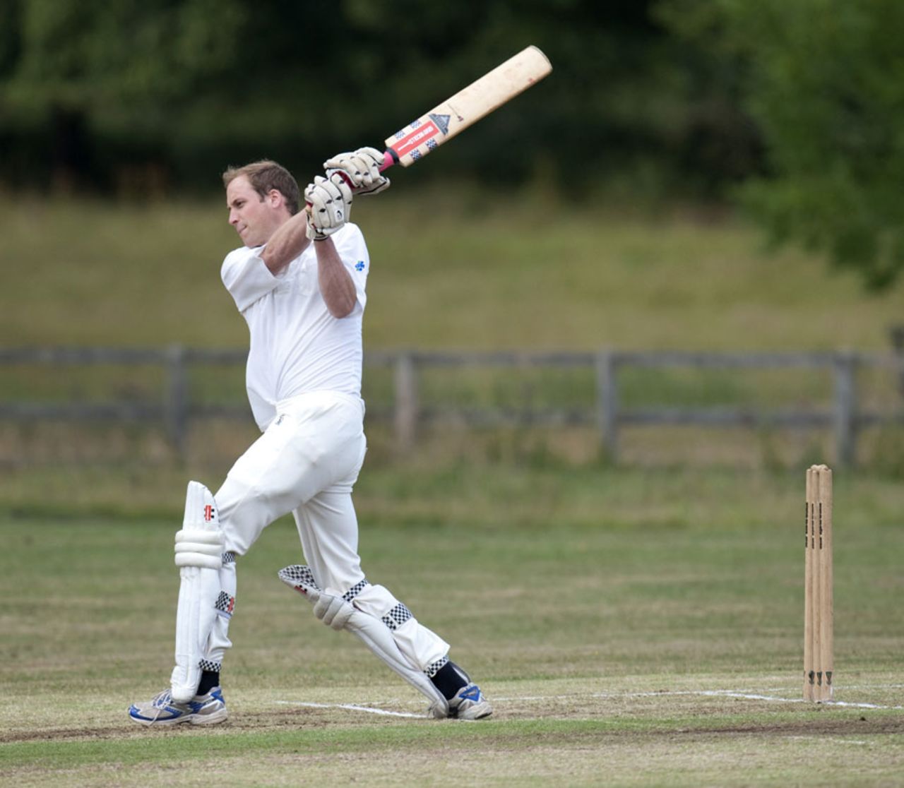 Prince William aims a leg-side swipe in a beer match for the Kings Head Inn at Bruern Abbey, Bruern, Oxfordshire