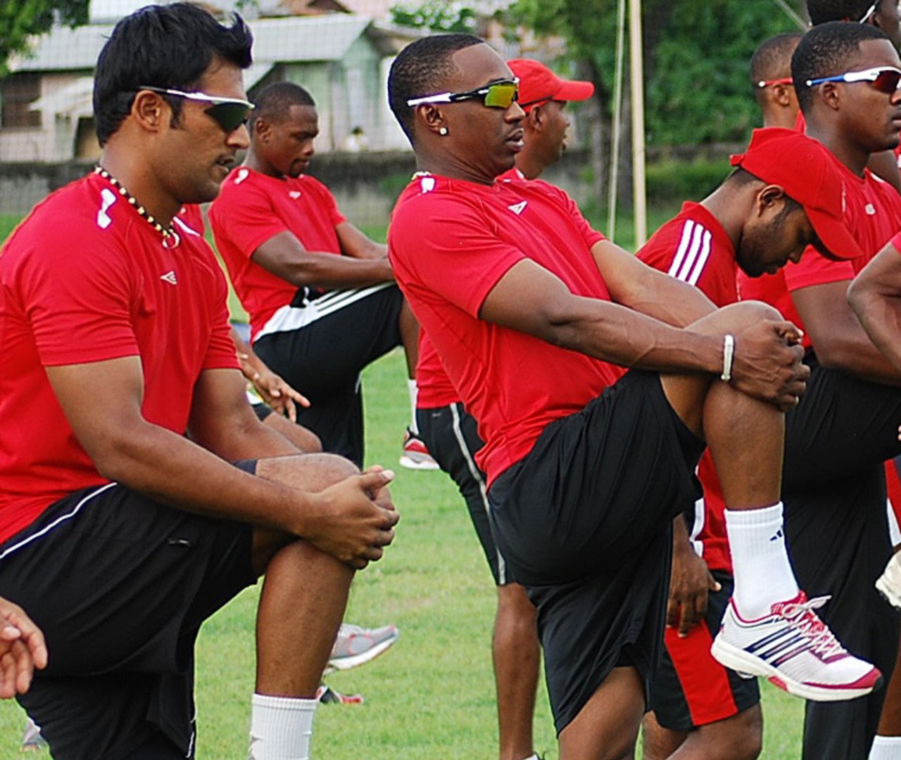 Daren Ganga and Dwayne Bravo go through the warm-up drills ahead of the Caribbean T20 event, July 20, 2010 