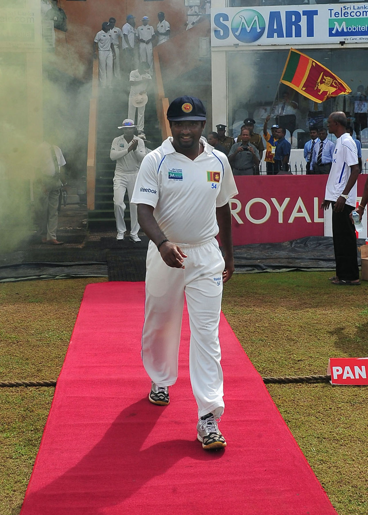 Muttiah Muralitharan walks down a red carpet into the field for his last day of Test cricket, Sri Lanka v India, 1st Test, Galle, 5th day, July 22, 2010