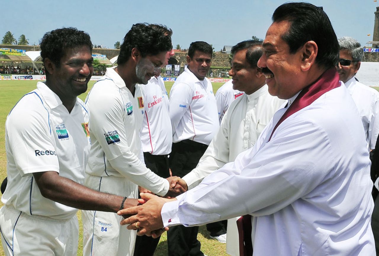 Sri Lanka president Mahinda Rajapakse shakes hands with Muttiah Muralitharan during the lunch interval, Sri Lanka v India, 1st Test, Galle, 5th day, July 22, 2010