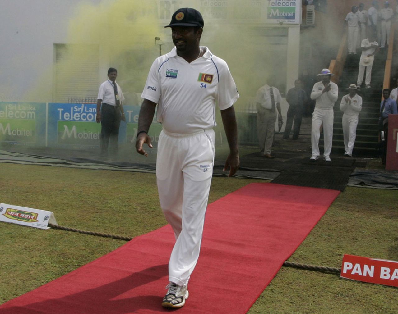 Muttiah Muralitharan walks down a red carpet into the field for his last day of Test cricket, Sri Lanka v India, 1st Test, Galle, 5th day, July 22, 2010