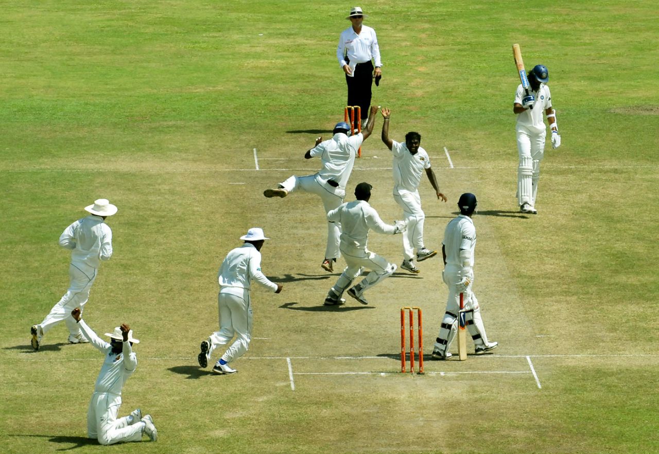 The Sri Lankan fielders converge on Muttiah Muralitharan after he picked his 800th Test wicket, Sri Lanka v India, 1st Test, Galle, 5th day, July 22, 2010