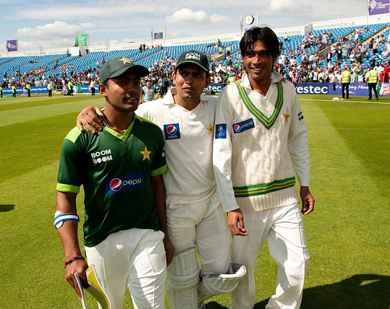 Umar Akmal, Kamran Akmal and Mohammad Amir walk the ground after the win, Pakistan v Australia, 2nd Test, Headingley, 4th day, July 24 2010