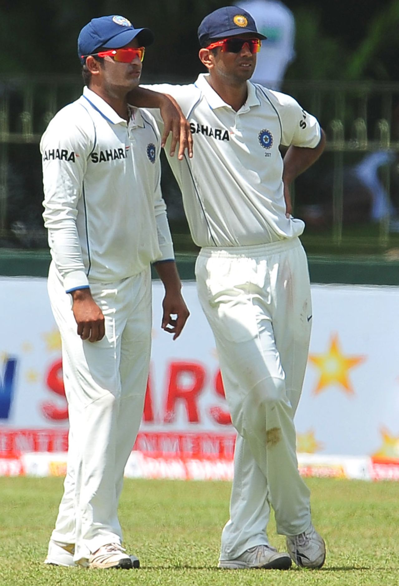Suresh Raina and Rahul Dravid look on during the morning session, Sri Lanka v India, 2nd Test, SSC, 1st day, July 26, 2010