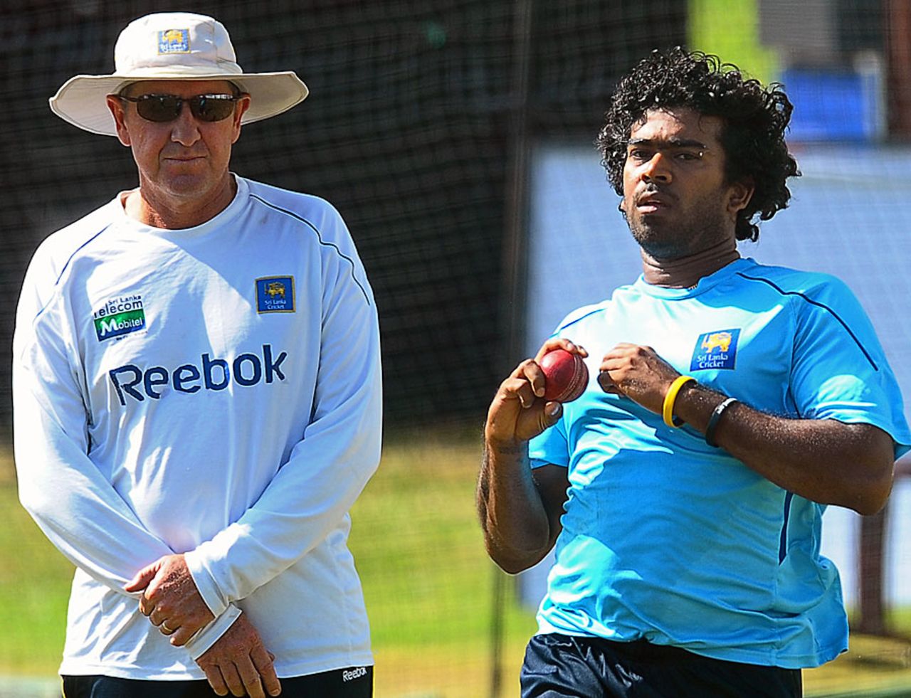Lasith Malinga bowls at the nets as coach Trevor Bayliss looks on, Colombo, August 1, 2010