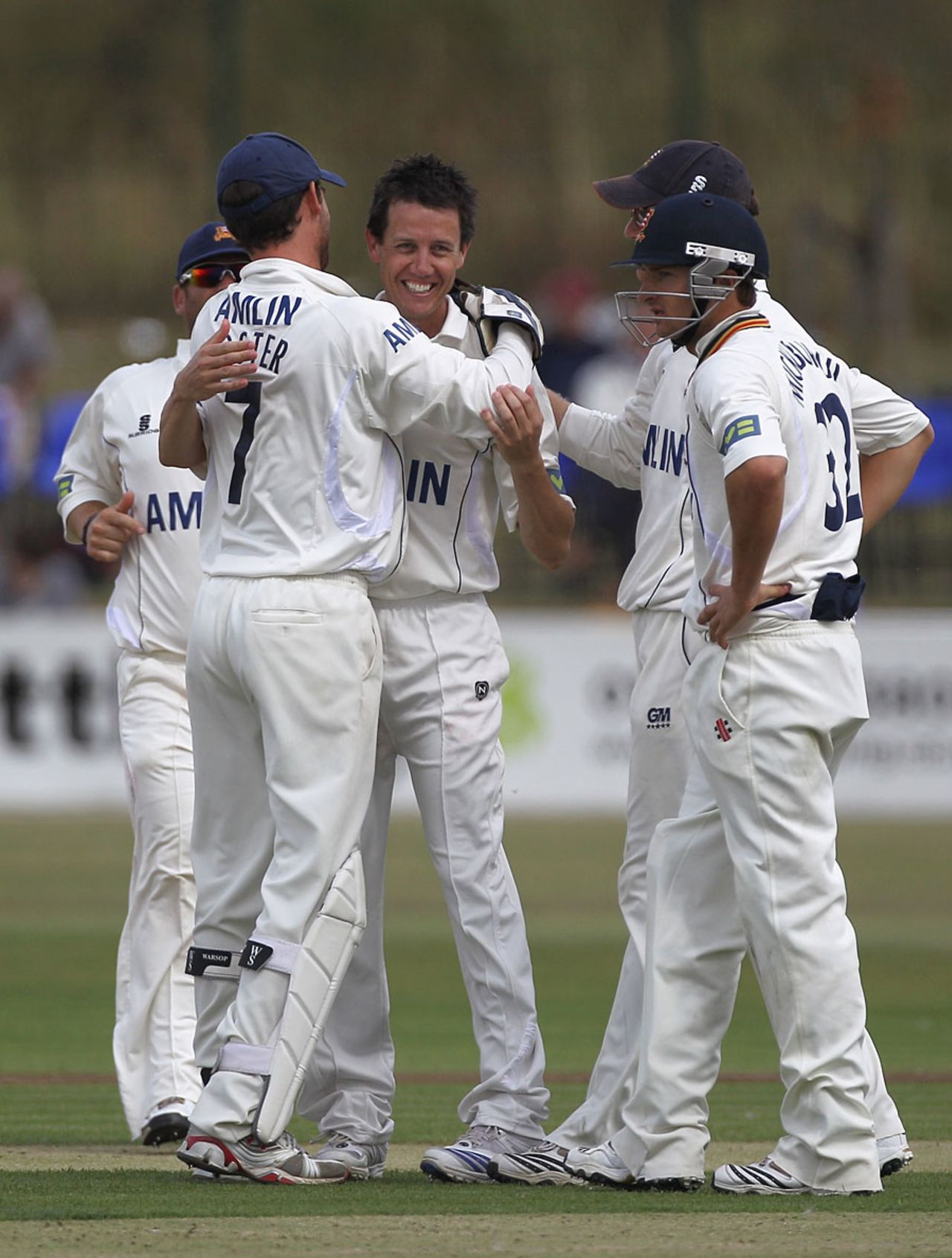 Bryce McGain is congratulated by his Essex team-mates after collecting four wickets, Essex v Warwickshire, County Championship Division One, Southend-on-Sea, August 5 2010 