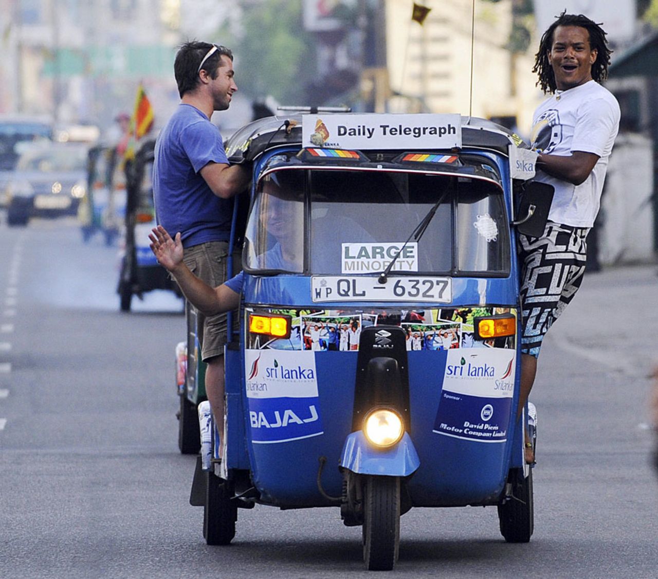 Tourists taking part in a Sri Lanka Tourism Board-sponsored <i>tuk tuk</i> race reach the finish line, Colombo, September 14, 2009