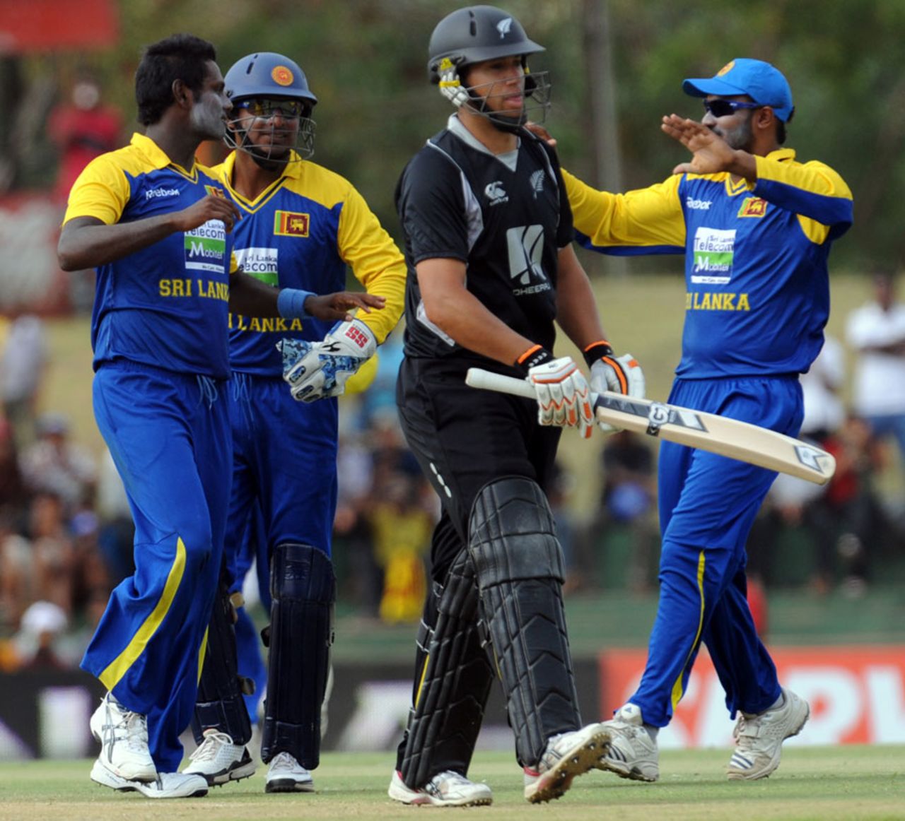 Angelo Mathews celebrates the dismissal of Ross Taylor with his team-mates, Sri Lanka v New Zealand, tri-series, 2nd ODI, Dambulla, August 13, 2010