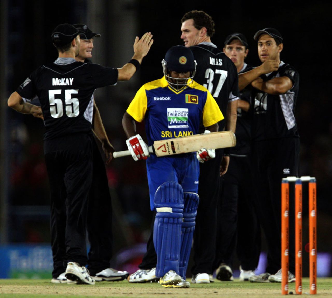Kyle Mills is congratulated by his team-mates after dismissing Rangana Herath, Sri Lanka v New Zealand, tri-series, 2nd ODI, Dambulla, August 13, 2010