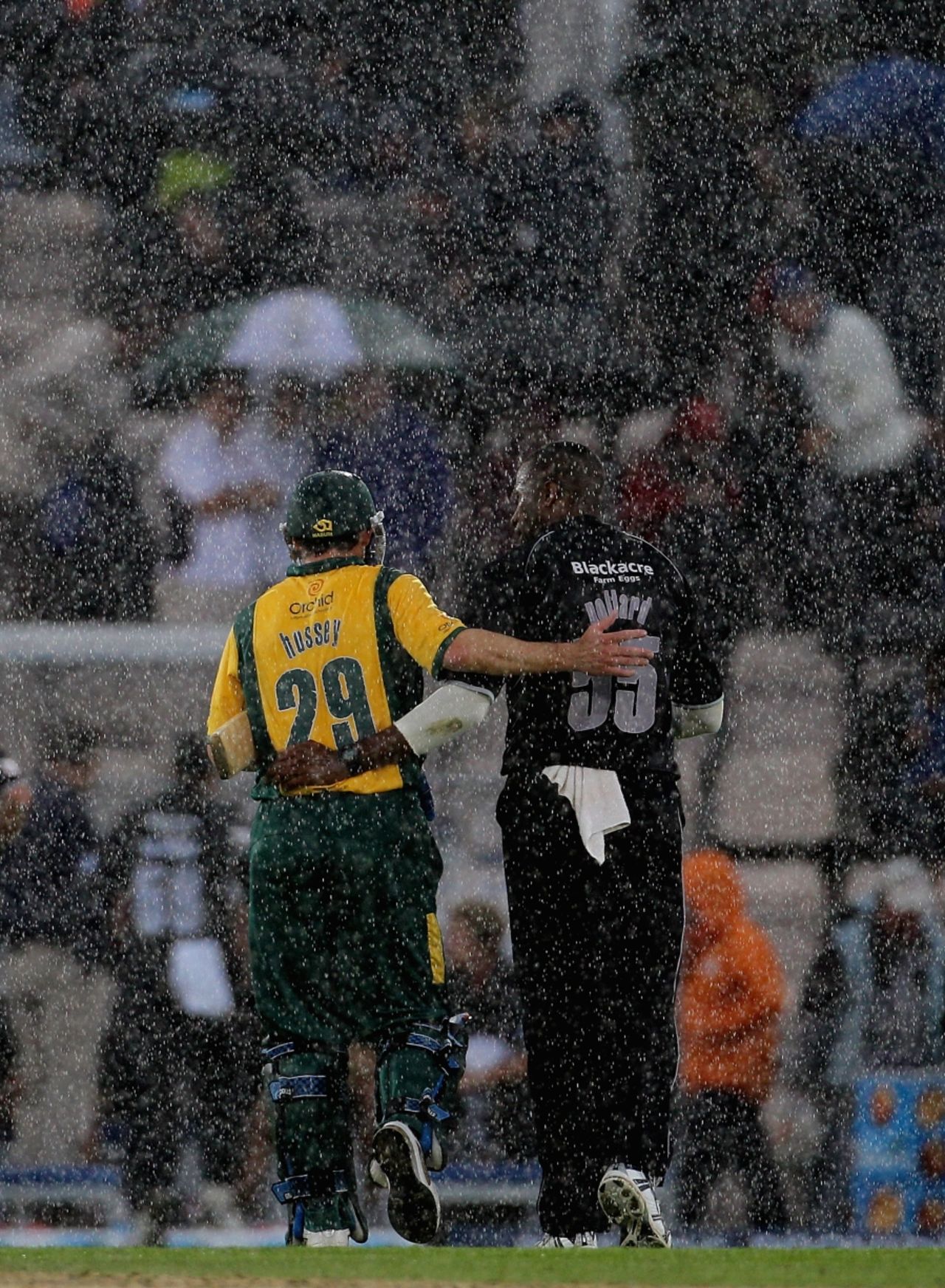 David Hussey and Kieron Pollard share a word as the rain pours down at the Rose Bowl, Nottinghamshire v Somerset, Friends Provident t20 Semi-Final, Rose Bowl, August 14 2010