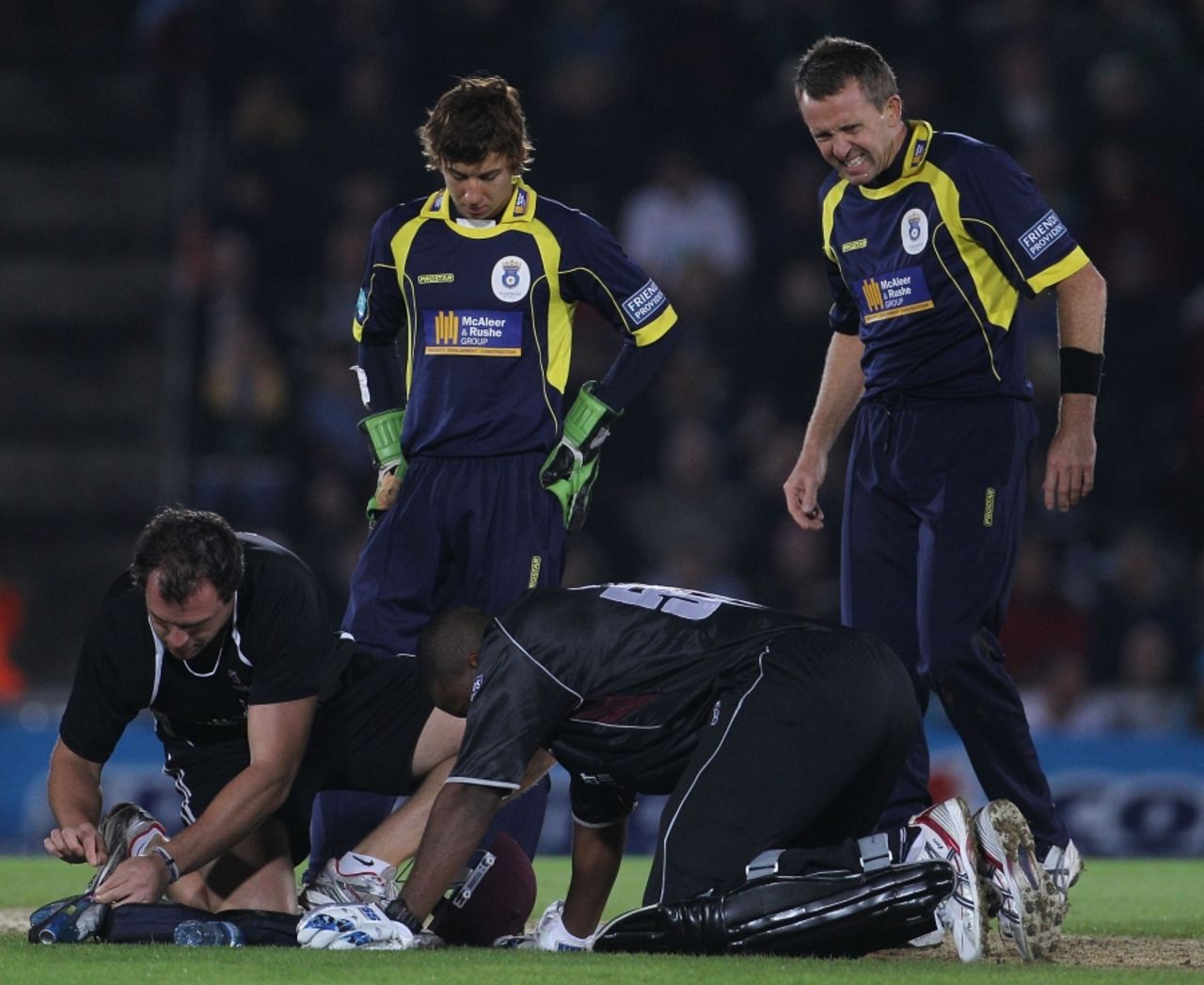 Dominic Cork grimaces as he notices the extent of Kieron Pollard's injury, Hampshire v Somerset, FP t20 Final, Rose Bowl, August 14 2010