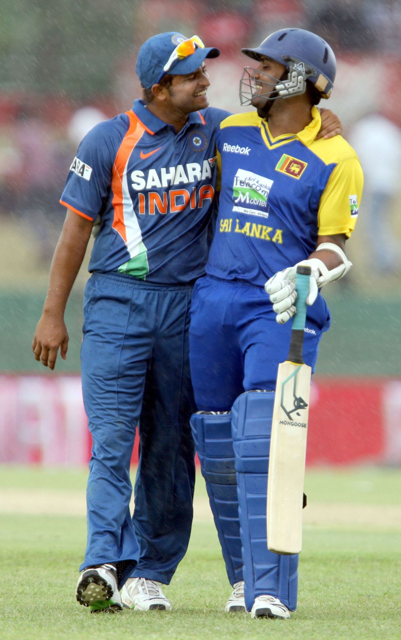 Suresh Raina and Chamara Kapugedera walk off the field during a rain break, Sri Lanka v India, tri-series, 3rd ODI, Dambulla, August 16, 2010