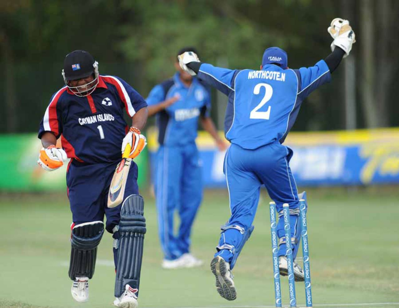 Pearson Best is run out for 85 by the Northcote brothers, Italy v Cayman Islands, ICC WCL Div. 4, Medicina, August 19, 2010
