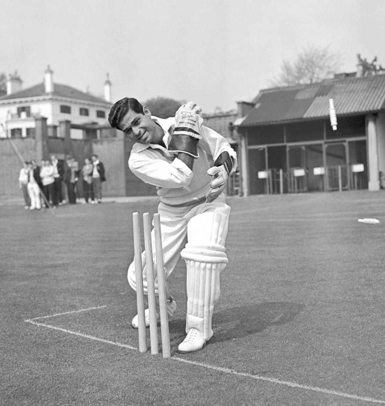 Indian wicketkeeper Naren Tamhane poses behind the stumps, April 21, 1959