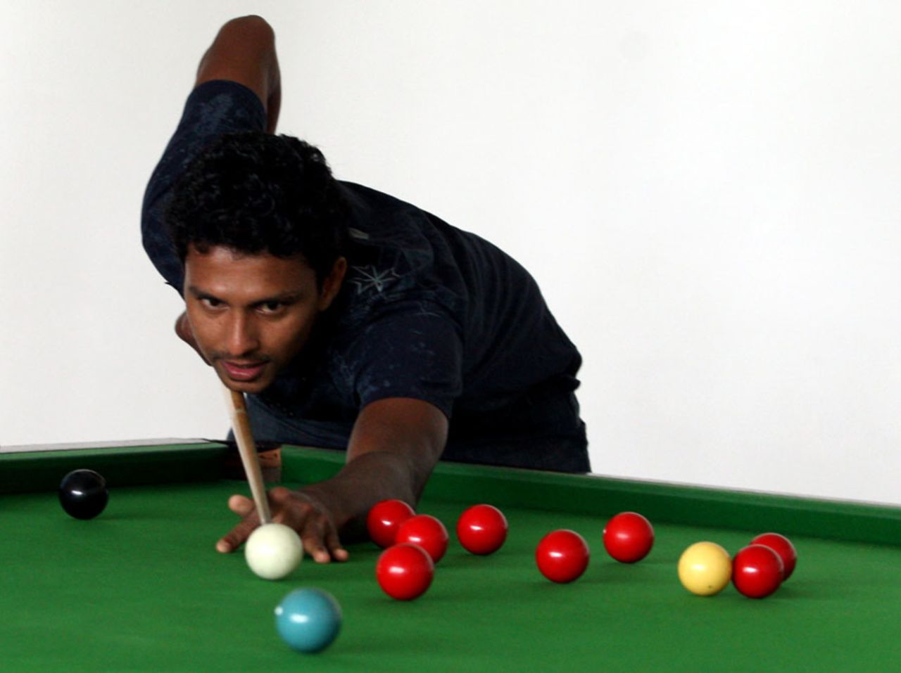 Suraj Randiv tries his hand at some snooker, Dambulla, August 21, 2010
