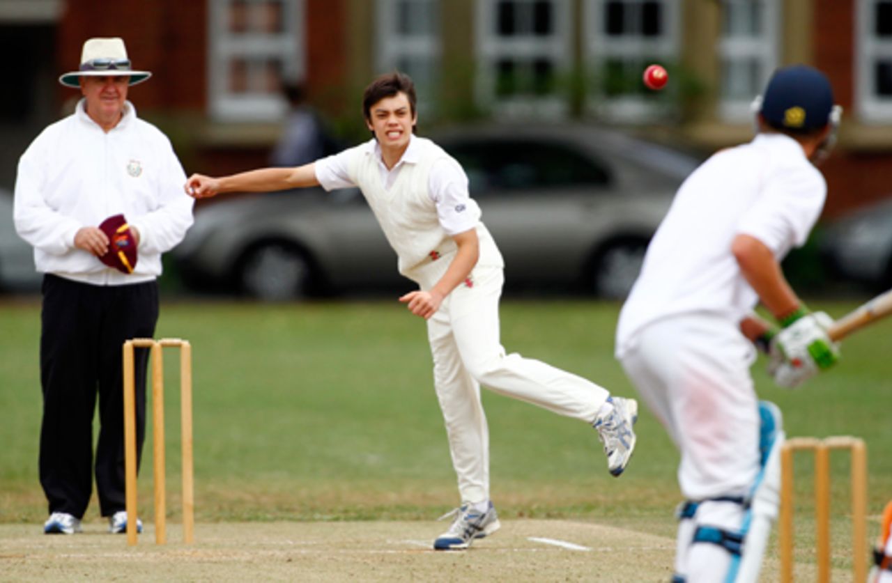 Mark Chapman bowling for Kings College against Mt Albert Grammar School in Auckland under the watchful eye of international umpire Doug Cowie