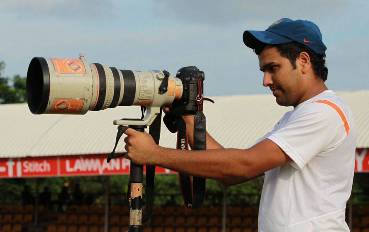 Rohit Sharma checks out a camera, Dambulla, August 27, 2010