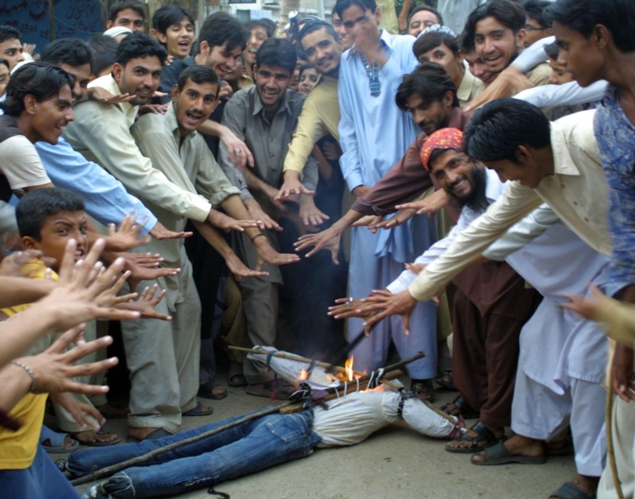 Protesting Pakistani cricket fans burn an effigy of national team captain Salman Butt, August 30 2010