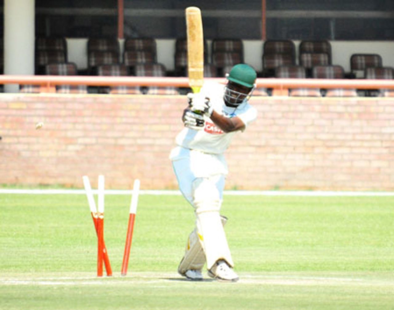 Mountaineers' Bernard Mlambo is cleaned up by Njabulo Ncube, Matabeleland Tuskers v Mountaineers, 4th day, league match, Logan Cup, Bulawayo, September 9, 2010