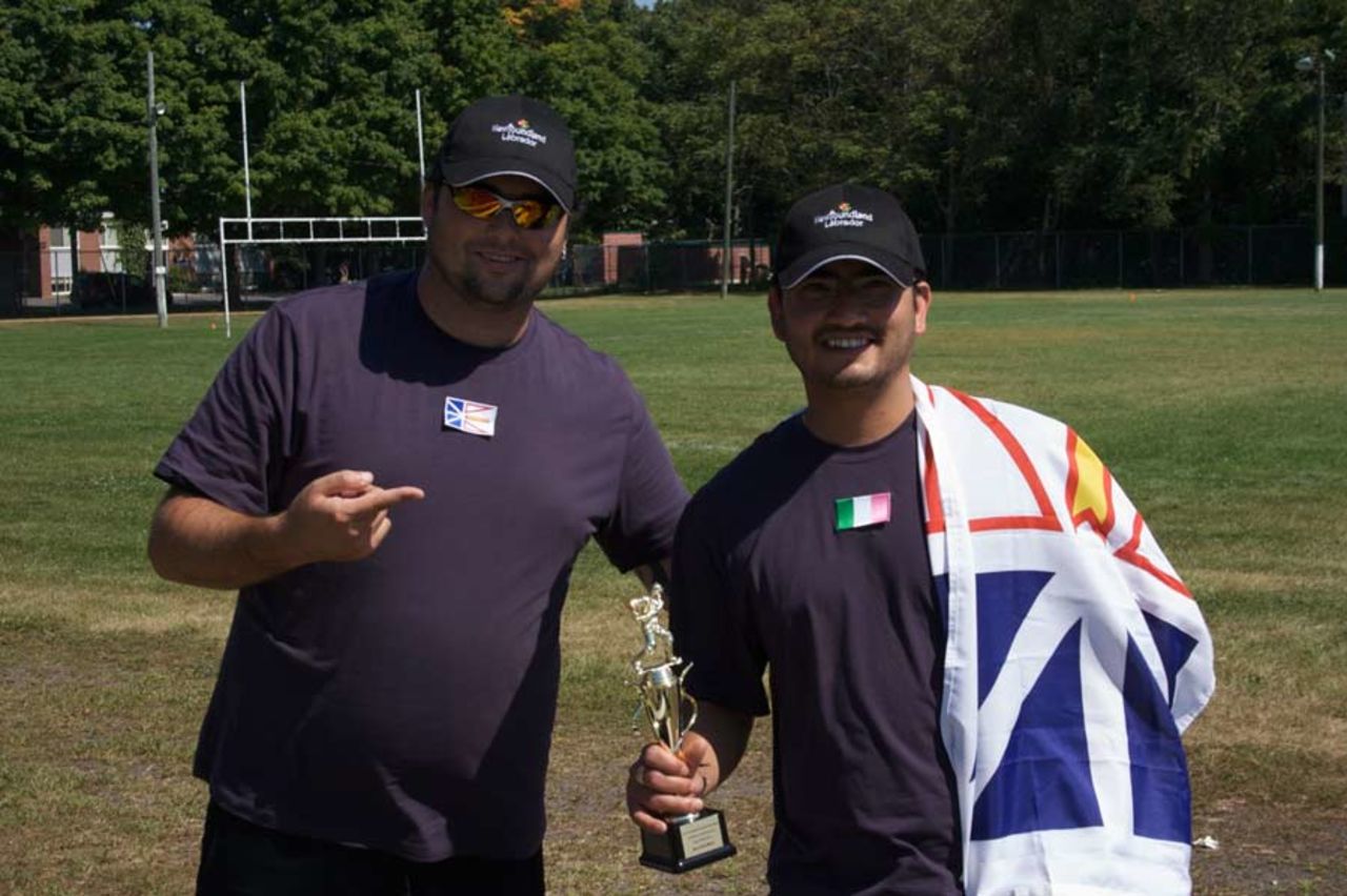 Rob Butler of Newfoundland & Labrador hands his team-mate Rakesh Negi his Man-of-the-Match trophy, New Brunswick v Newfoundland & Labrador, August 28, 2010