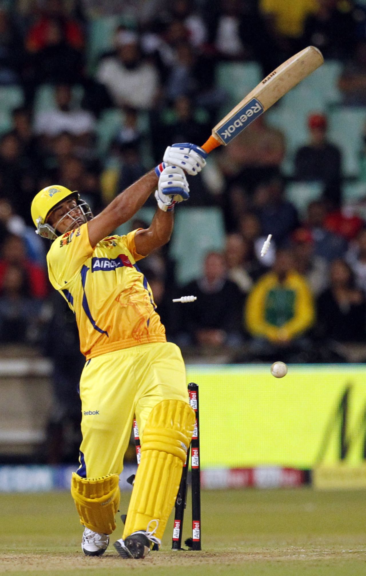 MS Dhoni is bowled while going for a big one, Chennai Super Kings v Royal Challengers Bangalore, Champions League Twenty20, Durban, September 24, 2010