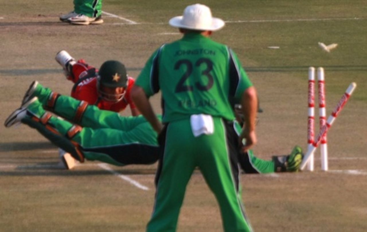 Trent Johnston watches Niall O'Brien attempt a run out, Zimbabwe v Ireland, 1st ODI, Harare, September 26, 2010