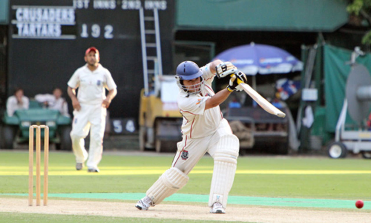 Roy Lamsam drives the ball during his innings of 69 for Crusaders versus Tartars at Kowloon Cricket Club on 2nd October 2010