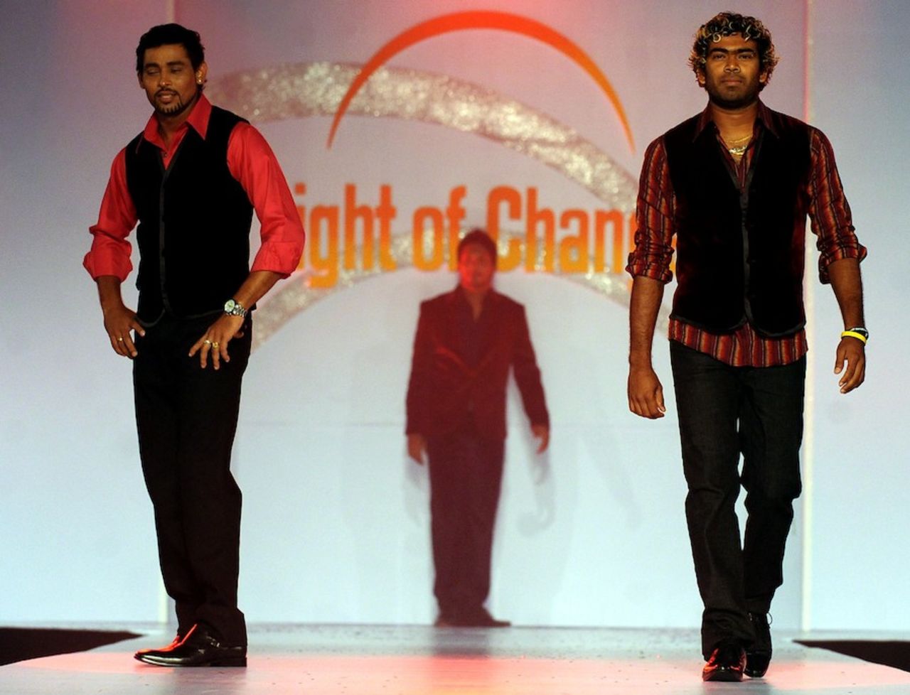 Tillakaratne Dilshan and Lasith Malinga take part in a fashion show, Colombo, October 11, 2010