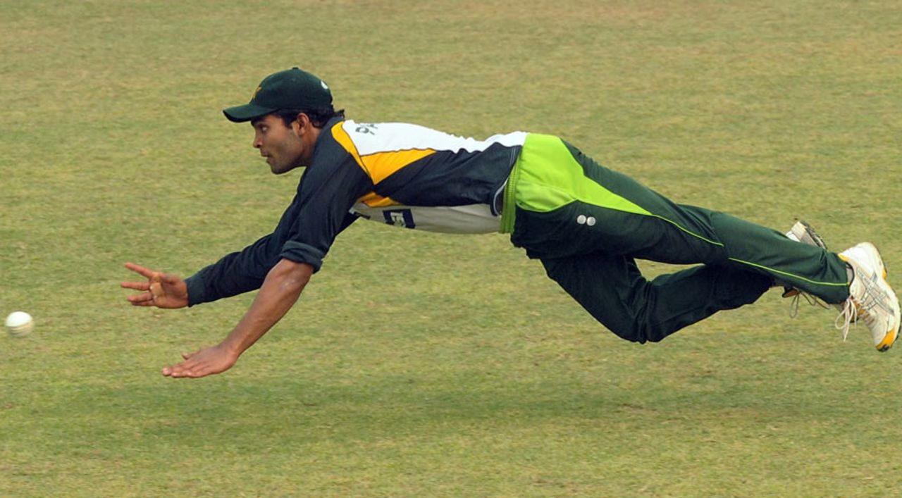 Umar Akmal dives in an attempt to stop the ball during a practice session, Gaddafi Stadium, Lahore, October 18, 2010
