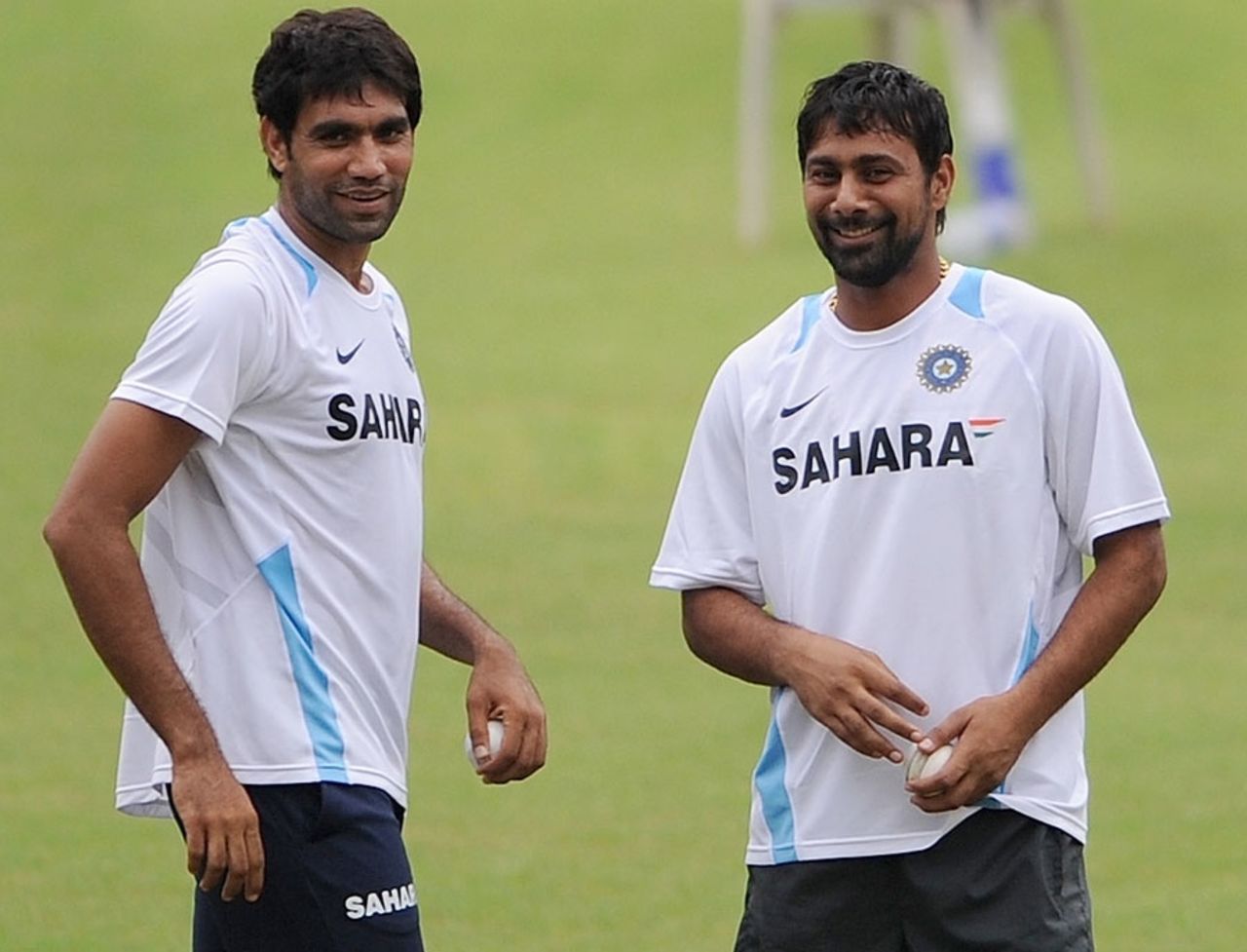 Munaf Patel and Praveen Kumar share a joke during practice, Margao, October 22, 2010