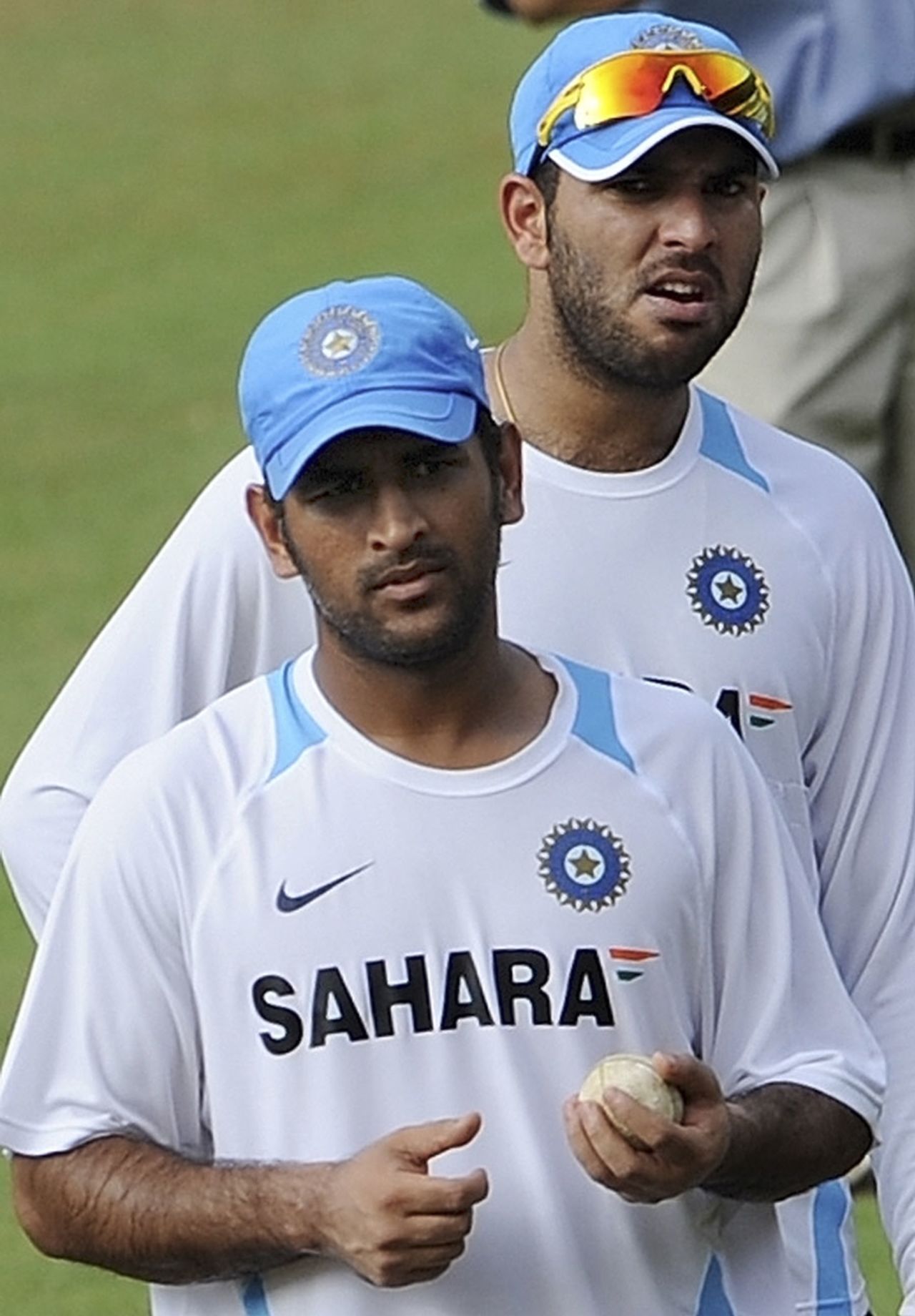 Yuvraj Singh and MS Dhoni wait for their turn to bowl in the nets, Margao, October 23, 2010