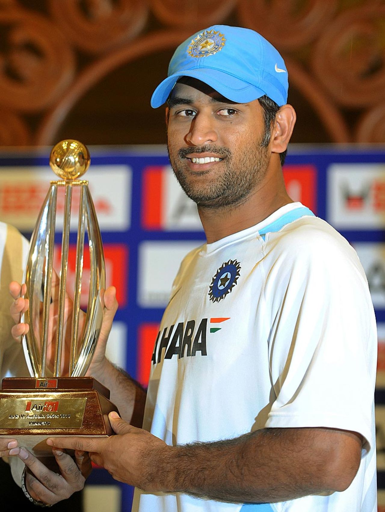 MS Dhoni poses with the series trophy, India v Australia, 3rd ODI, Margao, October 24, 2010