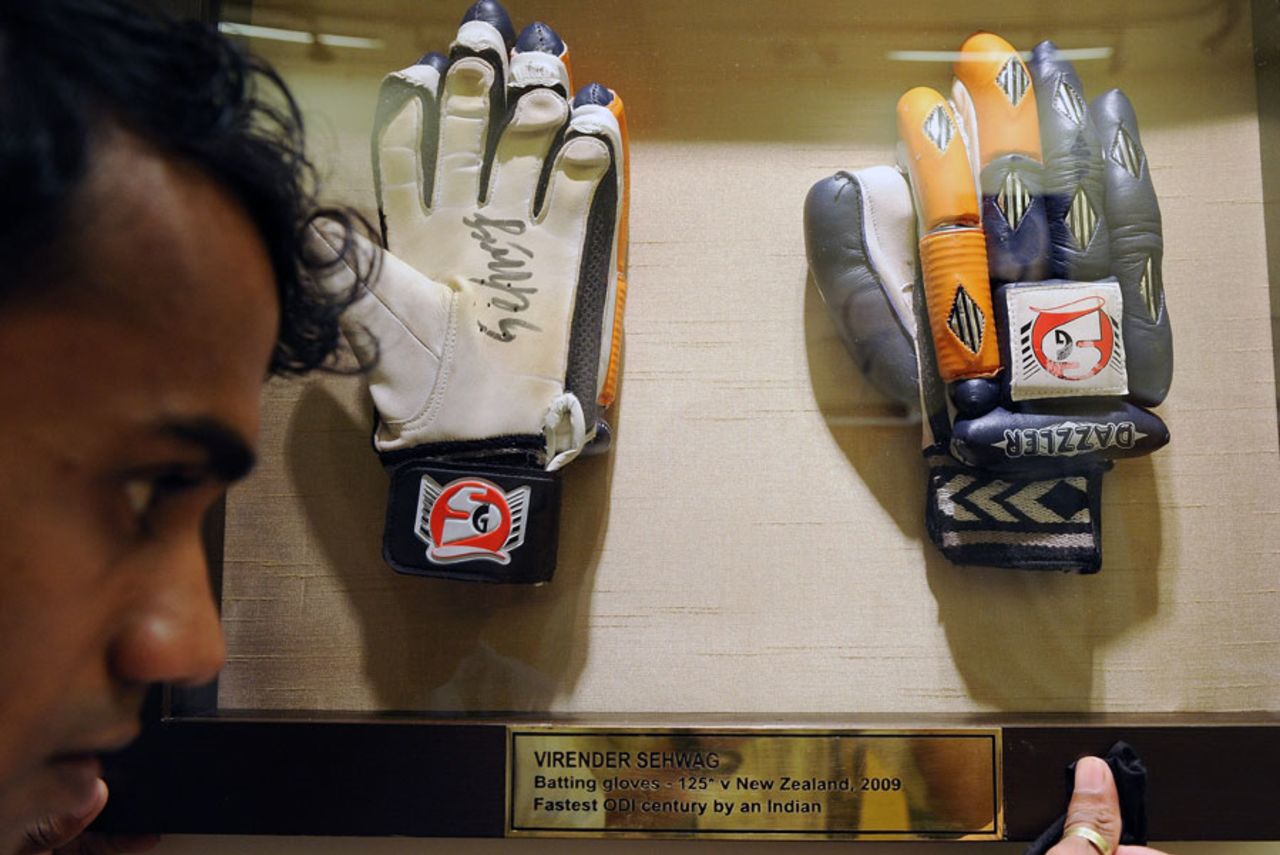 Virender Sehwag's gloves, worn during his record-breaking 125 against New Zealand in an ODI, get ready to be auctioned, Mumbai, October 26, 2010