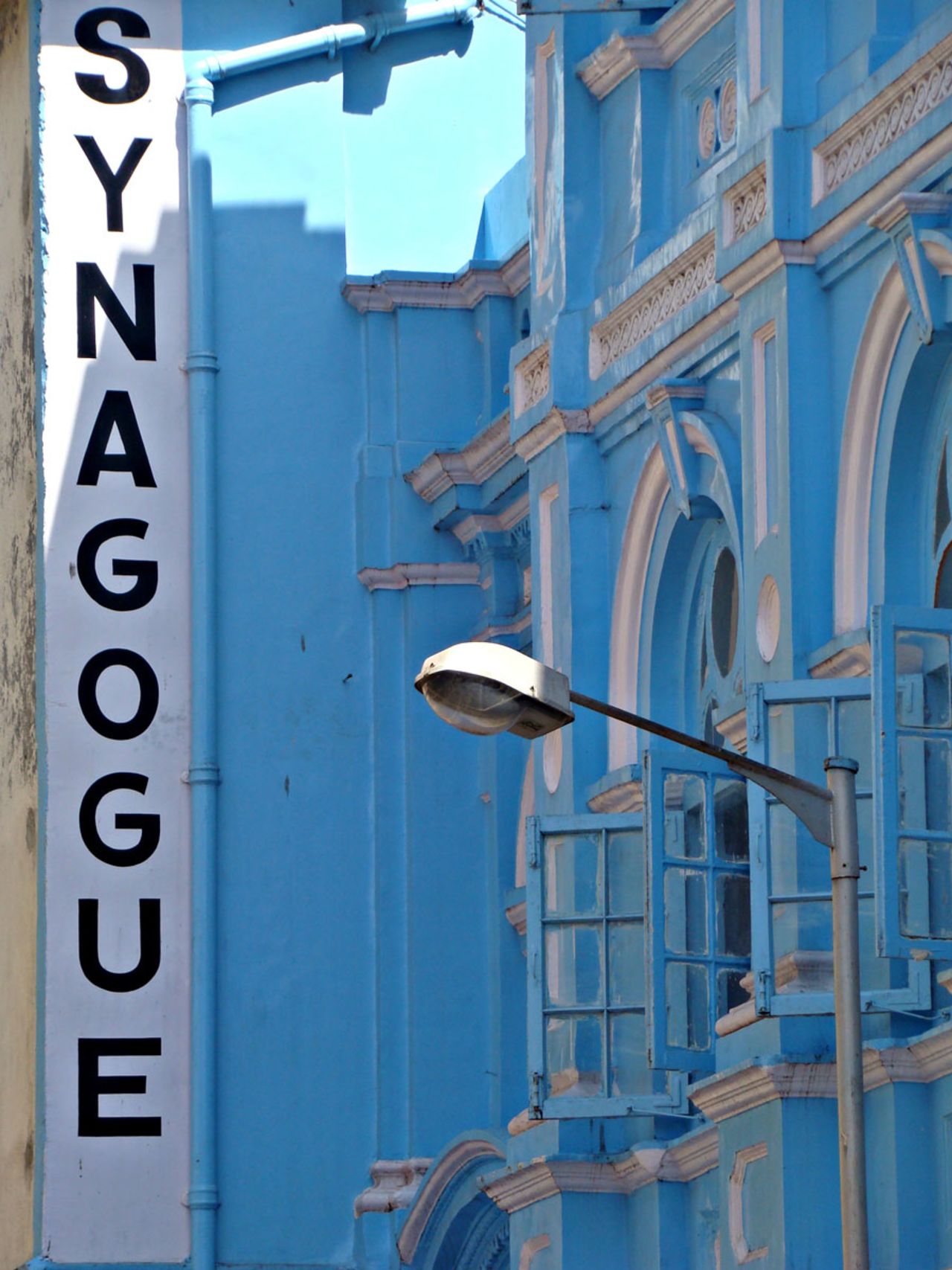 The Keneseth Eliyahoo Synagogue has an eye-catching blue facade, Mumbai