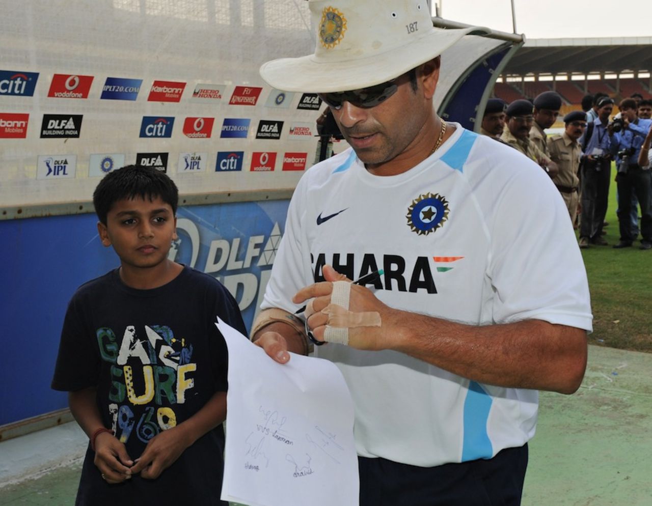 Sachin Tendulkar signs an autograph at Motera, Ahmedabad, November 1, 2010