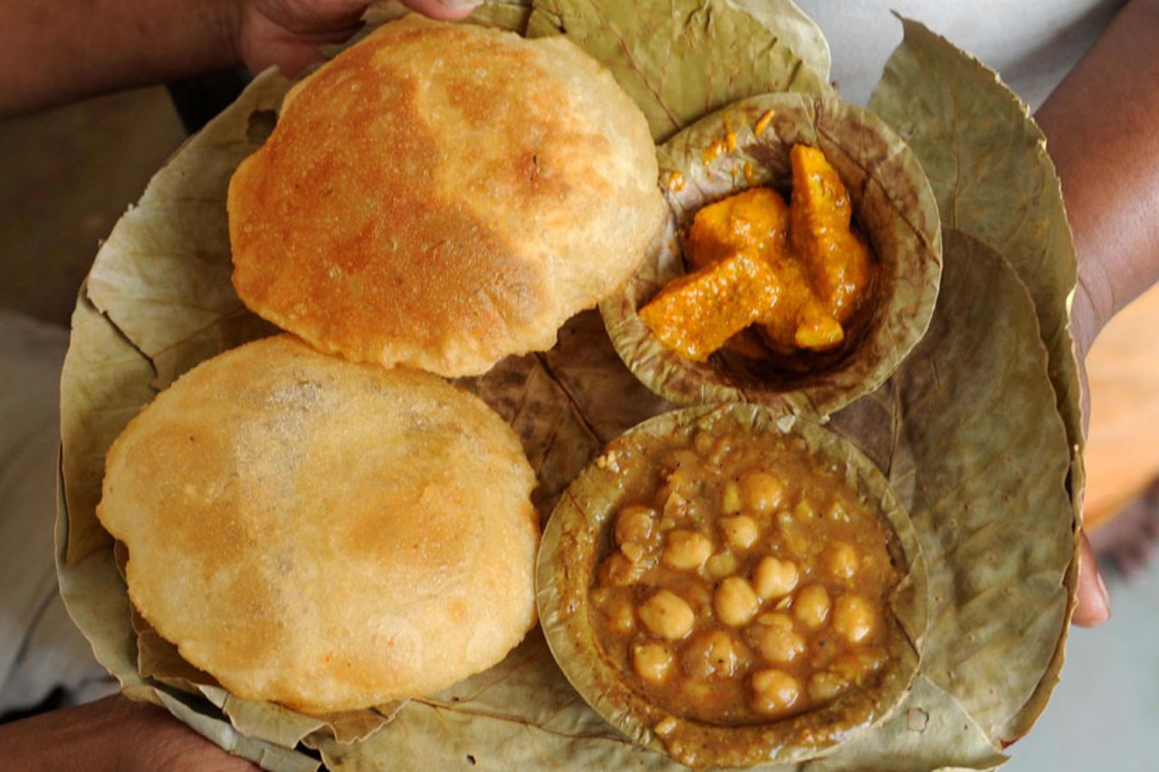 <i>Poori</i> and <i>chole</i>, an Indian meal of fried puffed bread and spicy chickpeas  curry, Amritsar, September 30, 2009