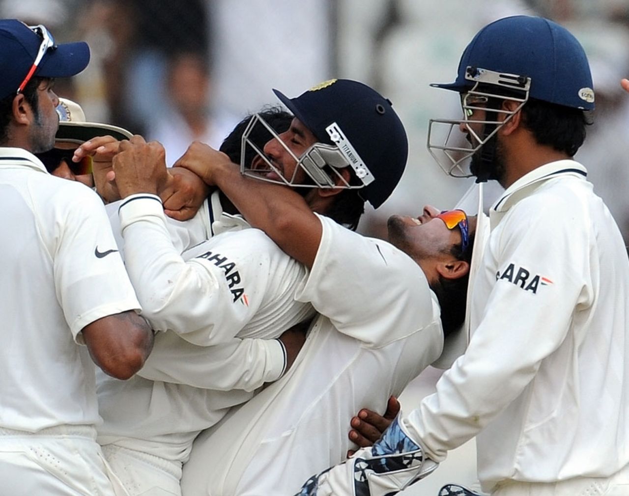 Cheteshwar Pujara is mobbed by team-mates after taking a sharp catch to dismiss Tim McIntosh, 2nd Test, Hyderabad, 4th day, November 15, 2010