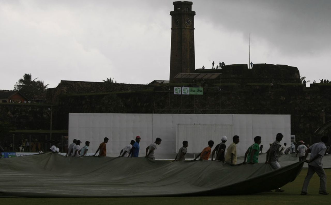 The ground staff brings on the covers as rain washes out the rest of the day's play after lunch, Sri Lanka v West Indies, 1st Test, Galle, 3rd day, November 17, 2010