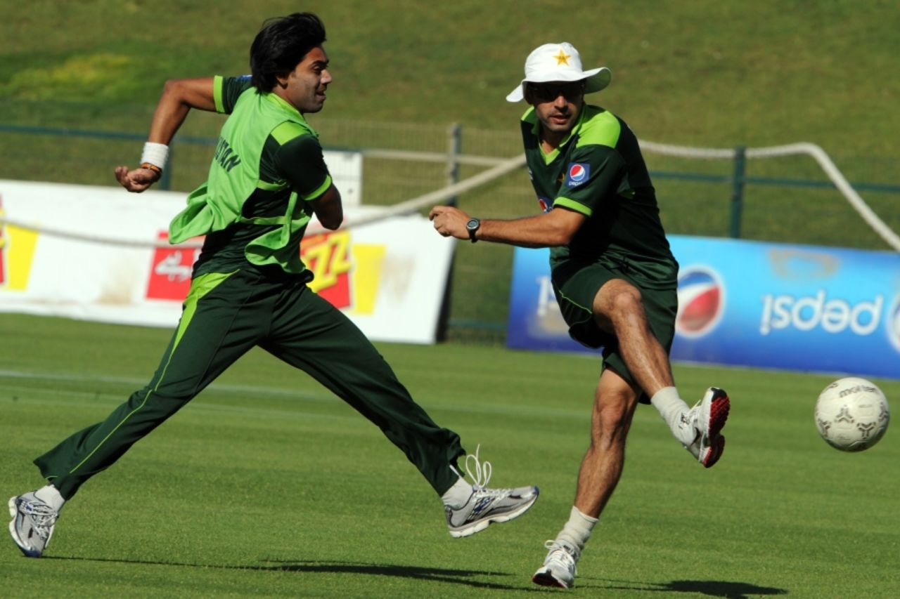 Misbah-ul-Haq and Mohammad Sami play a warm-up game of football during Pakistan's practice session, Abu Dhabi, November 18, 2010