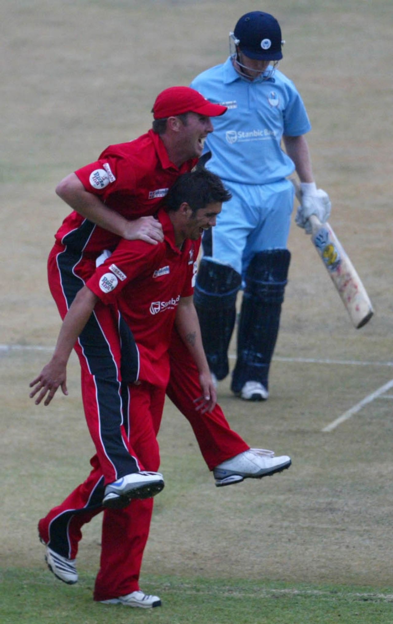 Brendan Taylor and Graeme Cremer celebrate the dismissal of Tuskers' Adam Wheater, Matabeleland Tuskers v Mid West Rhinos, Stanbic Bank 20 Series, Harare, November 19, 2010