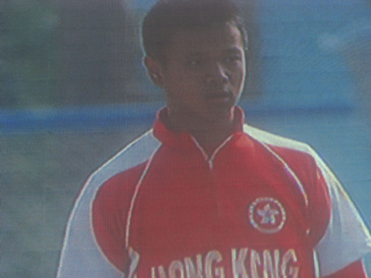 Li Kai Ming appears on the big screen in his debut match for Hong Kong against Maldives at the 16th Asian Games