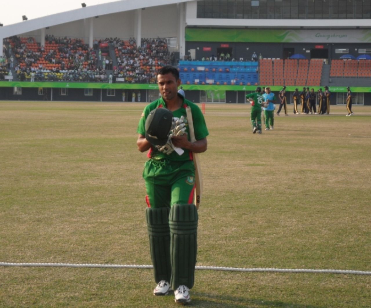 Faisal Hossain, Bangladesh's top scorer, leaves the field after being dismissed for 33, Bangladesh v Sri Lanka, Asia Games, Guangzhou, November 25, 2010